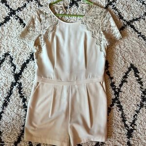 Cream colored lace romper. Open back cocktail attire.
